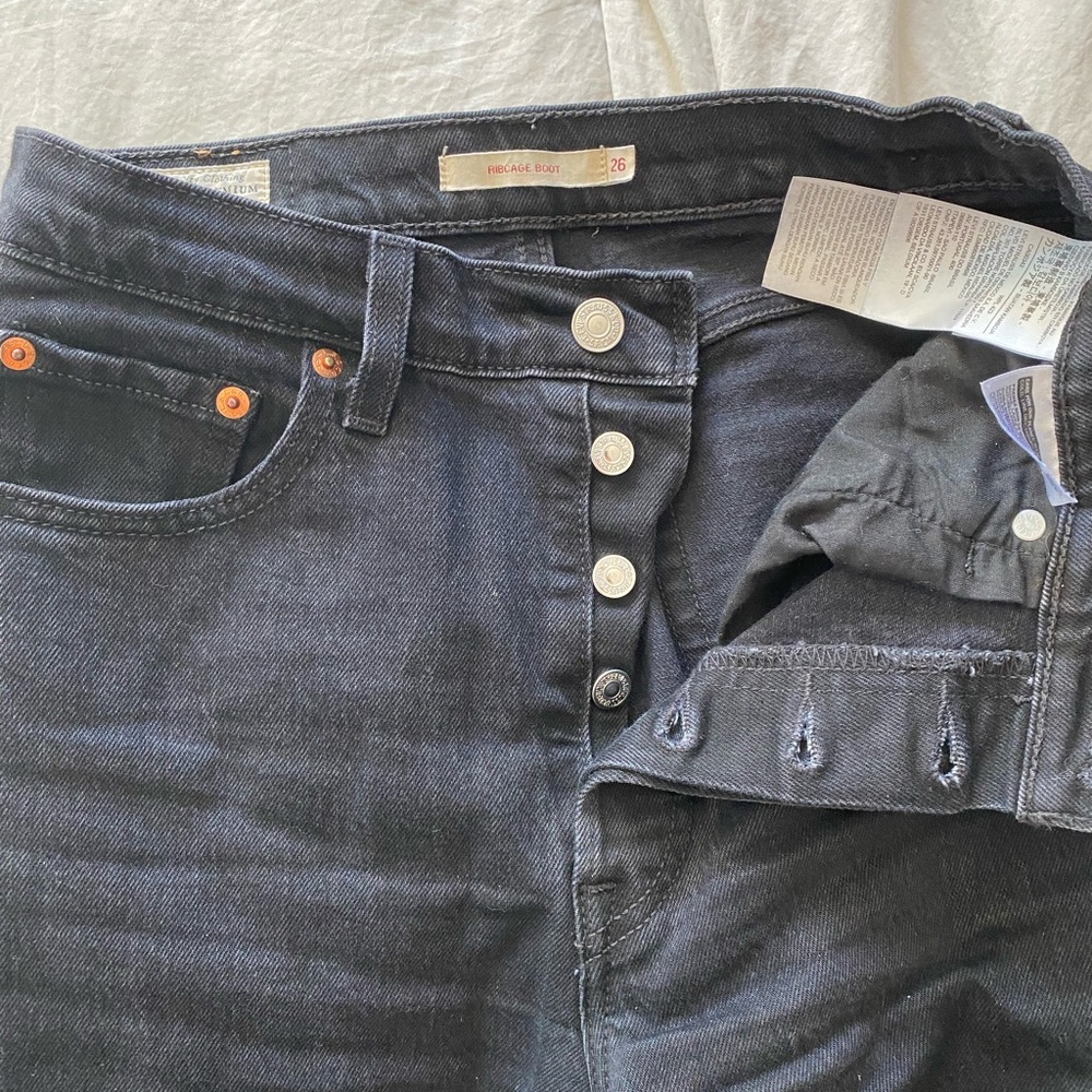 Black, boot cut Levi’s rib cage jeans